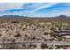 Community aerial showing desert landscape, mountain views, and a golf course at 8395 E Leaning Rock Rd # 187, Scottsdale, AZ 85266