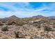 Elevated view of modern homes in a desert setting, highlighting natural landscape and mountain views at 8395 E Leaning Rock Rd # 187, Scottsdale, AZ 85266