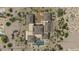 Aerial view of a luxury home with a pool, outdoor seating, and manicured desert landscaping at 8395 E Leaning Rock Rd # 187, Scottsdale, AZ 85266