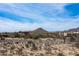 High up aerial view of home sites nestled between a desert terrain and local mountains at 8395 E Leaning Rock Rd # 187, Scottsdale, AZ 85266