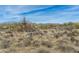 Expansive desert landscape with native vegetation and scattered homes under a blue sky at 8395 E Leaning Rock Rd # 187, Scottsdale, AZ 85266