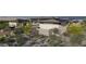 A modern home's exterior is accented by desert landscaping, providing a natural and sustainable design at 8395 E Leaning Rock Rd # 187, Scottsdale, AZ 85266