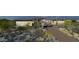 A modern home featuring desert landscaping, a private driveway, and a stylish exterior design at 8395 E Leaning Rock Rd # 187, Scottsdale, AZ 85266