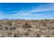 Scenic view of desert property featuring native plants and rolling hills with homes nestled throughout landscape at 8395 E Leaning Rock Rd # 187, Scottsdale, AZ 85266