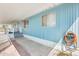 Blue home exterior featuring a covered patio and convenient access with updated outdoor lighting and well maintained exterior at 8600 E Broadway Rd # 28, Mesa, AZ 85208