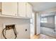 Small laundry area with overhead cabinets and access for washer and dryer hookups at 8600 E Broadway Rd # 28, Mesa, AZ 85208