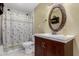 Well-lit bathroom featuring a decorative mirror, vanity and tub/shower combo at 8724 N 42Nd Ave, Phoenix, AZ 85051