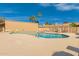 Community pool with poolside seating and clear blue sky on a sunny day at 9028 E Winchcomb Dr, Scottsdale, AZ 85260