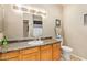 Bathroom featuring a vanity with granite countertops and a large mirror at 10030 W Indian School Rd # 226, Phoenix, AZ 85037