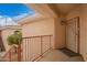 Balcony view of a unit's front door with decorative security door at 10030 W Indian School Rd # 226, Phoenix, AZ 85037