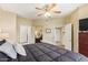 This bedroom offers a doorway to the bathroom and a mirror leaning against the wall at 10030 W Indian School Rd # 226, Phoenix, AZ 85037