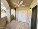 Covered tiled balcony featuring archways, and a storage closet at 10401 N 52Nd St # 124, Paradise Valley, AZ 85253