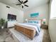 Well-lit bedroom featuring a king bed, ceiling fan, and beach themed art at 10401 N 52Nd St # 124, Paradise Valley, AZ 85253