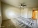 Spacious bedroom featuring neutral walls, patterned carpeting, and a ceiling fan at 10401 N 52Nd St # 124, Paradise Valley, AZ 85253