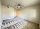 Bright bedroom featuring neutral walls, patterned carpeting, and a ceiling fan at 10401 N 52Nd St # 124, Paradise Valley, AZ 85253