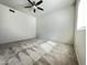 Bright bedroom with a ceiling fan, carpeted floor, and natural light from a window at 10401 N 52Nd St # 124, Paradise Valley, AZ 85253