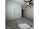 Bright bedroom with a ceiling fan, carpeted floor, and two white doors at 10401 N 52Nd St # 124, Paradise Valley, AZ 85253