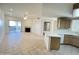 Bright living room with tile flooring, modern fireplace, and kitchen view at 10401 N 52Nd St # 124, Paradise Valley, AZ 85253