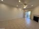 Bright living room with tile flooring, modern fireplace, and sliding glass door to patio at 10401 N 52Nd St # 124, Paradise Valley, AZ 85253