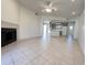 Spacious living room featuring tile flooring, modern fireplace, and a kitchen at 10401 N 52Nd St # 124, Paradise Valley, AZ 85253