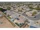 Aerial view of the backyard, featuring desert landscaping, solar panels, and a neighborhood view at 10505 W Wilshire Dr, Avondale, AZ 85392