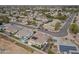 Aerial view of homes in a quiet suburban neighborhood with mature landscaping and solar panels at 10505 W Wilshire Dr, Avondale, AZ 85392