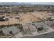 Expansive aerial view of desert home with a desert landscape, ample parking, and mountain views at 10505 W Wilshire Dr, Avondale, AZ 85392