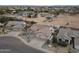 An aerial view shows a desert home with a two car garage and drought resistant landscaping at 10505 W Wilshire Dr, Avondale, AZ 85392