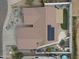 This aerial view showcases a private backyard with a pool, patio, garden and solar panels at 10505 W Wilshire Dr, Avondale, AZ 85392