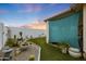 Desert landscaping with cacti and succulents, plus rock and turf accents, decorate this backyard at 10505 W Wilshire Dr, Avondale, AZ 85392