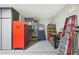 Organized garage space with tool storage, shelving, and ample room for projects at 10505 W Wilshire Dr, Avondale, AZ 85392