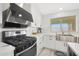 Bright and airy kitchen with stainless steel appliances and modern fixtures at 10505 W Wilshire Dr, Avondale, AZ 85392