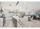 Gourmet kitchen featuring a waterfall island, modern appliances, and an open layout at 10505 W Wilshire Dr, Avondale, AZ 85392