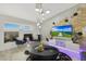 Elegant living room featuring modern lighting, geometric wall decor, and stylish furniture at 10505 W Wilshire Dr, Avondale, AZ 85392