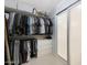 Organized walk-in closet featuring custom shelving and sliding doors for efficient storage at 10505 W Wilshire Dr, Avondale, AZ 85392