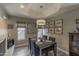 Cozy dining room featuring a modern light fixture, a fireplace, and tasteful decor at 10557 E Fanfol Ln, Scottsdale, AZ 85258