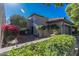 Charming home featuring desert landscaping, a brick walkway, and a cozy, enclosed two-car garage at 10557 E Fanfol Ln, Scottsdale, AZ 85258