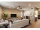 Bright and airy living room with high ceilings, a fireplace, and modern furnishings at 10557 E Fanfol Ln, Scottsdale, AZ 85258