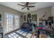 Spacious home office with french doors, ceiling fan, and abundant natural light at 10557 E Fanfol Ln, Scottsdale, AZ 85258