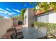 Private brick patio featuring outdoor seating, citrus tree, flowers and a grill at 10557 E Fanfol Ln, Scottsdale, AZ 85258