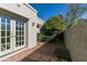 Private brick patio featuring outdoor seating and a mature citrus tree at 10557 E Fanfol Ln, Scottsdale, AZ 85258