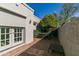 Private brick patio featuring outdoor seating and a mature citrus tree at 10557 E Fanfol Ln, Scottsdale, AZ 85258