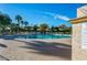 Outdoor pool with chairs and umbrellas on the pool deck and desert landscaping around the pool area at 10557 E Fanfol Ln, Scottsdale, AZ 85258