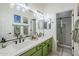 Modern bathroom featuring double sinks and a glass shower at 10672 N 140Th Way, Scottsdale, AZ 85259