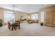 Formal dining room with a wooden dining table, pendant lighting, and large windows at 10672 N 140Th Way, Scottsdale, AZ 85259