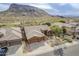 Beautiful single-story home featuring desert landscaping and a tile roof with mountain views at 10672 N 140Th Way, Scottsdale, AZ 85259