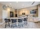 Bright kitchen featuring an island with barstool seating and modern appliances, and a neutral color palette at 10672 N 140Th Way, Scottsdale, AZ 85259