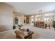 Open-concept living room featuring neutral colors and views into the dining room at 10672 N 140Th Way, Scottsdale, AZ 85259