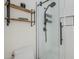 Modern walk-in shower with white subway tile and matte black hardware at 10672 N 140Th Way, Scottsdale, AZ 85259