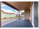 Cozy covered back patio with a paved area, perfect for outdoor entertaining and relaxation at 1100 E Vernoa St, San Tan Valley, AZ 85140